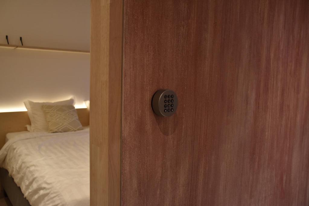 Postel nebo postele na pokoji v ubytování Poutrelle Guestrooms