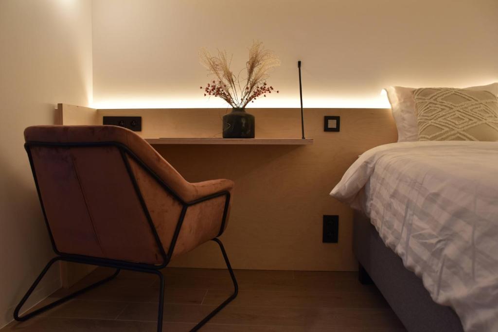 Postel nebo postele na pokoji v ubytování Poutrelle Guestrooms