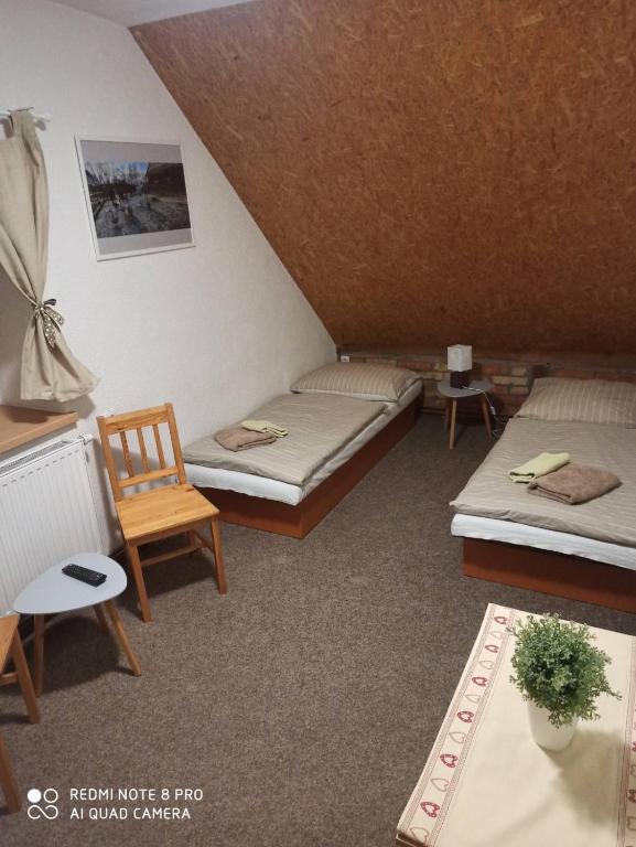 Postel nebo postele na pokoji v ubytování Ranč u Sedmi Kulí