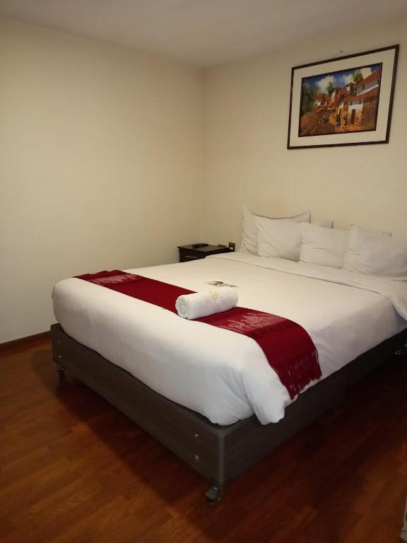 Postel nebo postele na pokoji v ubytování Golden Inca Hotel