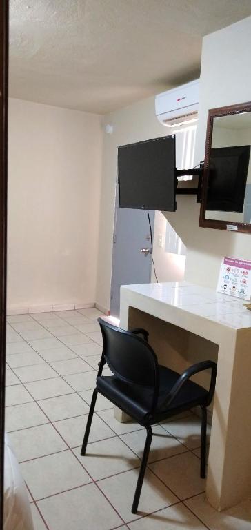 TV a/nebo společenská místnost v ubytování Pearl Point Hotel