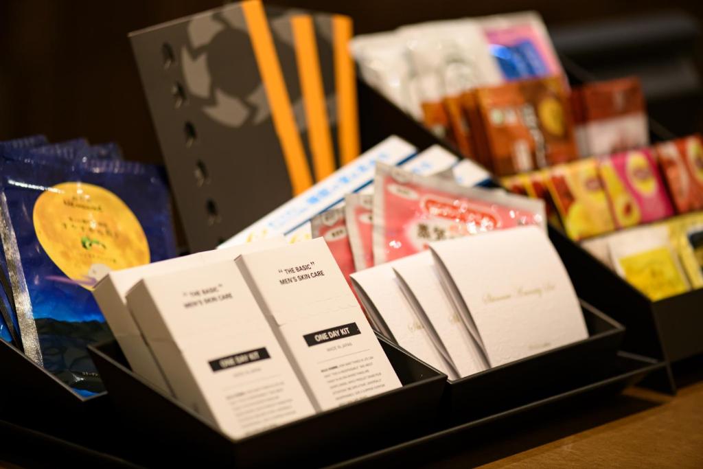 a group of books sitting on top of a table at remm plus Kobe Sannomiya in Kobe