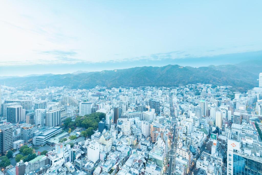 an aerial view of a city with buildings at remm plus Kobe Sannomiya in Kobe
