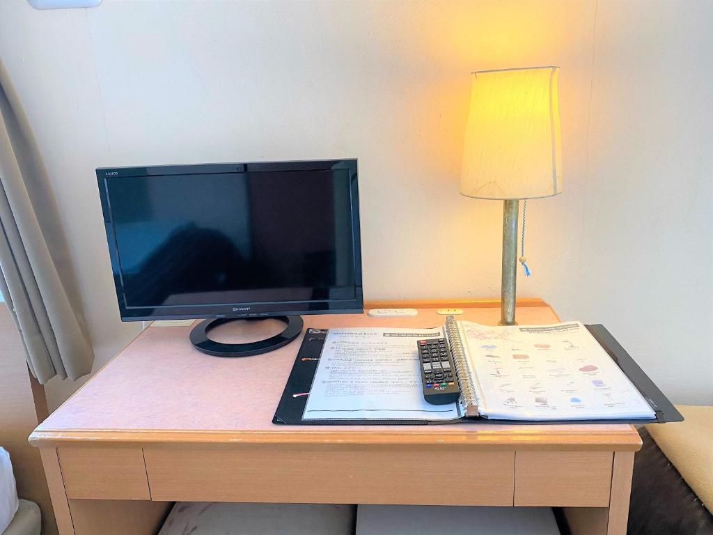 TV a/nebo společenská místnost v ubytování Sakura Hotel Hatagaya