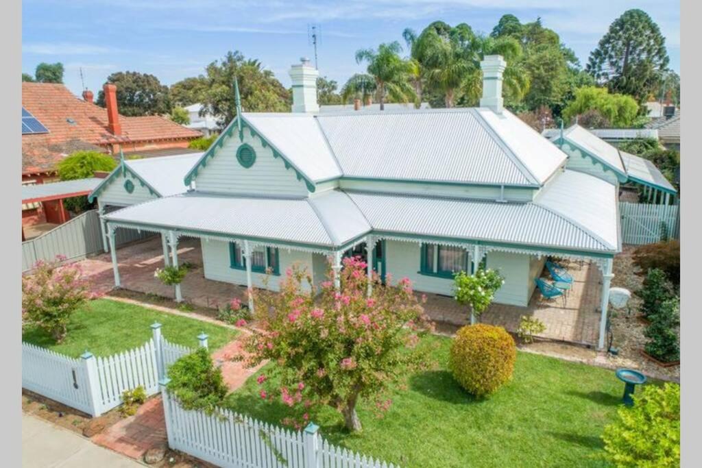 an aerial view of a house with a white fence at Wandew - Echuca Holiday Homes in Echuca