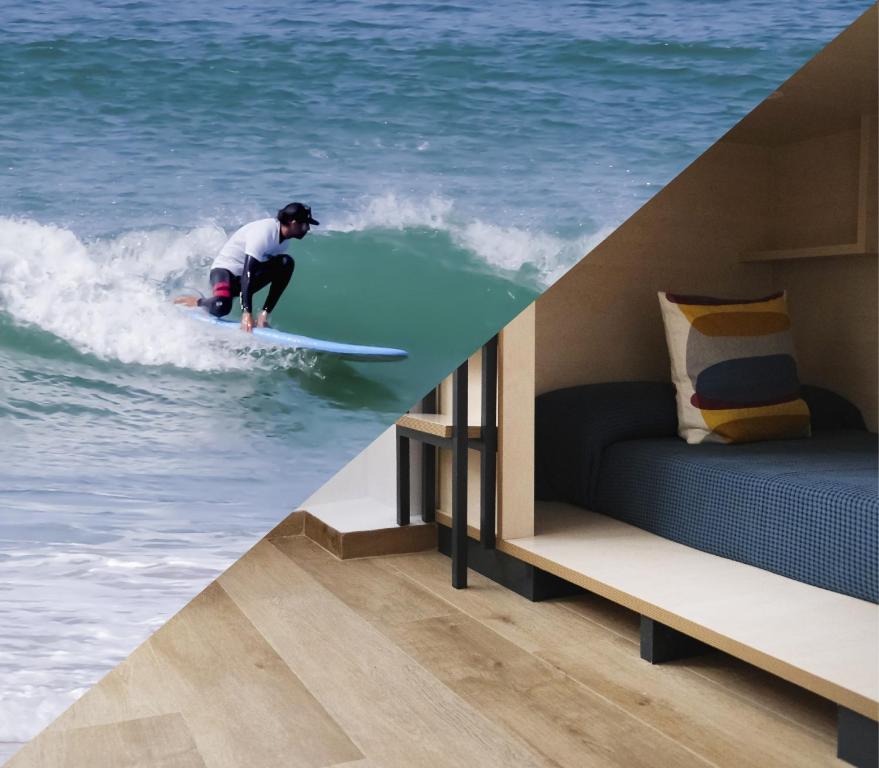 Un uomo che cavalca un'onda su una tavola da surf nell'oceano di TAKE SURF Hostel Conil a Conil de la Frontera