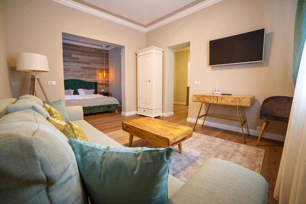 Ένα ή περισσότερα κρεβάτια σε δωμάτιο στο Garrison's Suites