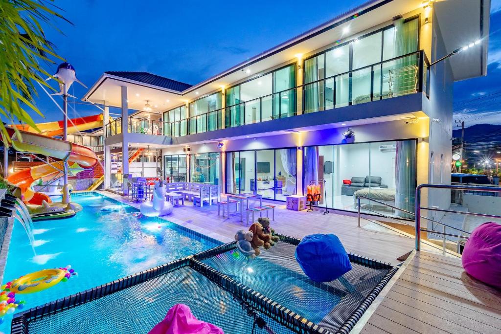 a house with a pool with a water slide at Smart home huahin in Hua Hin