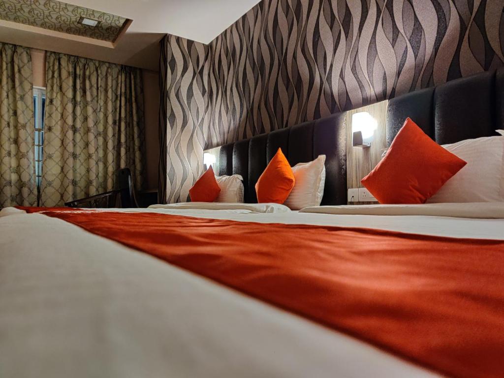 Postel nebo postele na pokoji v ubytování Hotel Vip Square