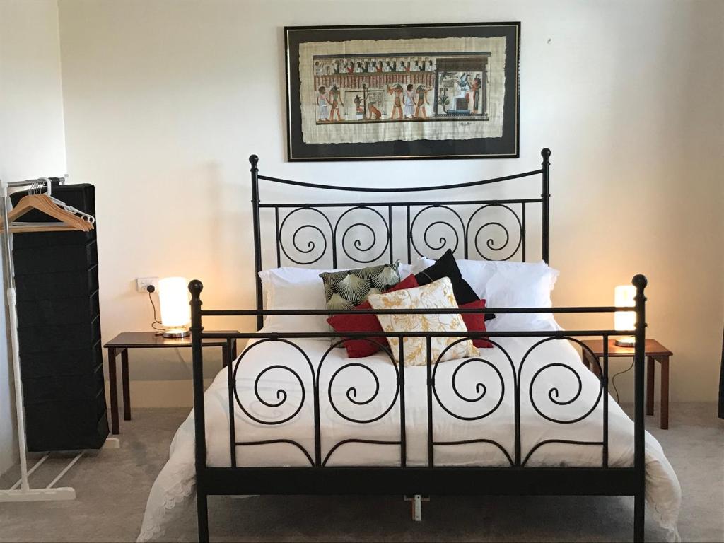 a black and white bed in a room at Jen's Escape Albany in Albany