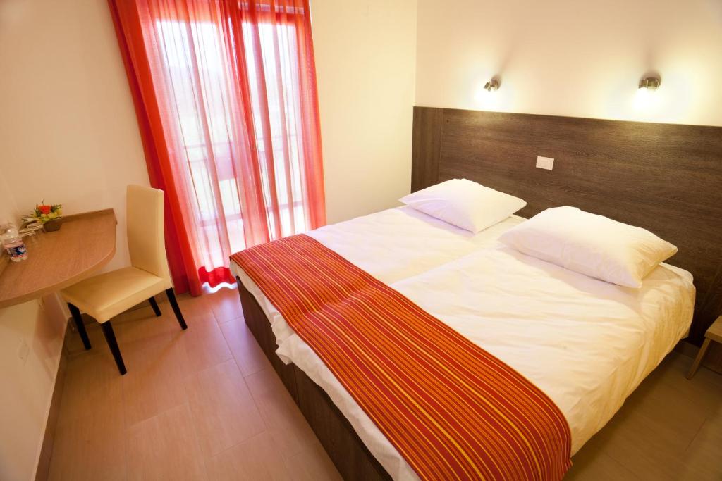 Letto o letti in una camera di Guesthouse Ošterija