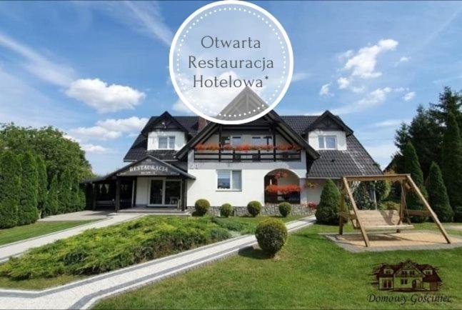 uma casa com um sinal que diz Olivia Residência Hudson em Motel Domowy Gościniec em Łomża