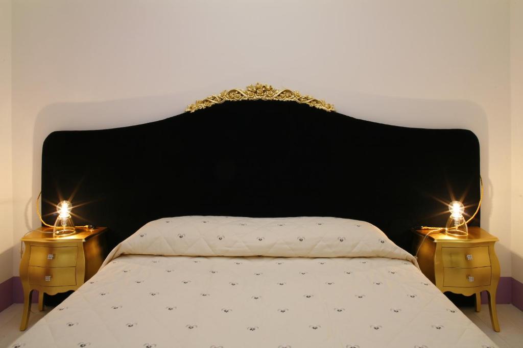 Postel nebo postele na pokoji v ubytování Tenuta Santi Giacomo e Filippo