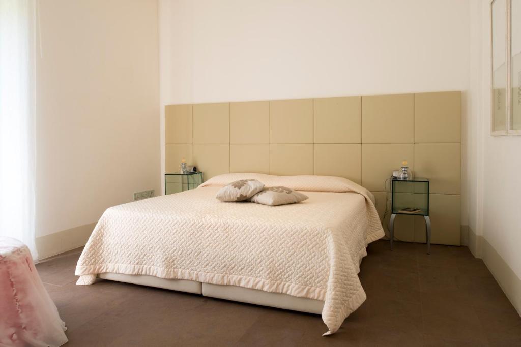 Postel nebo postele na pokoji v ubytování Tenuta Santi Giacomo e Filippo