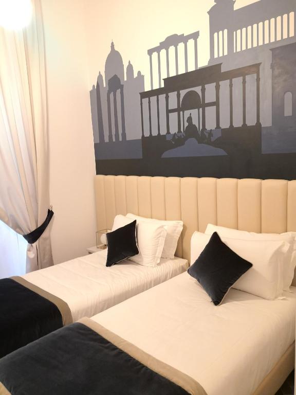 Posteľ alebo postele v izbe v ubytovaní Frattina FF italian suites