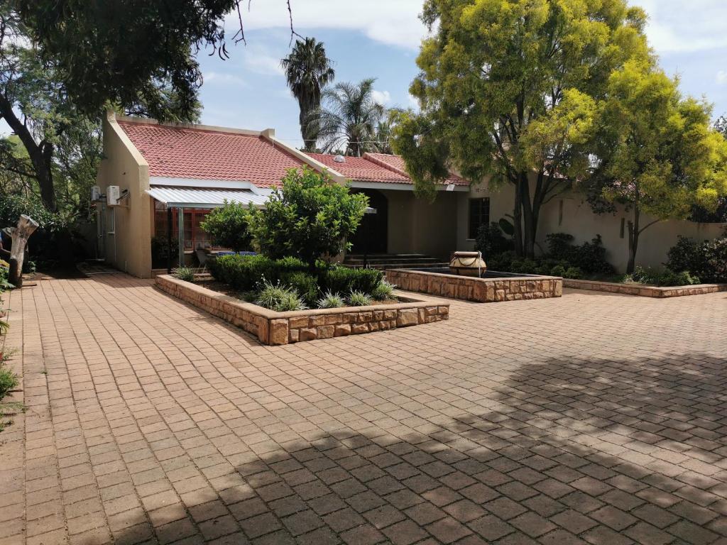 Κήπος έξω από το Gluckman Drive Guesthouse