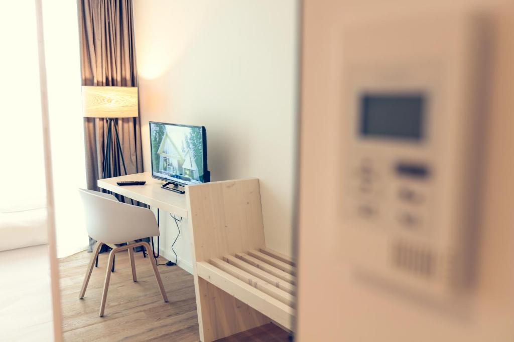 TV a/nebo společenská místnost v ubytování Klingenstein AKZENT Hotel Wirtshaus Brauerei