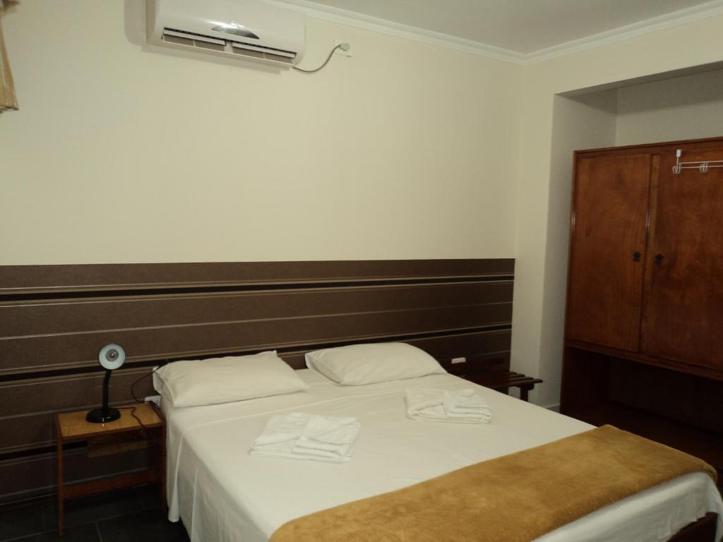 Postel nebo postele na pokoji v ubytování Iguassu Central Flats