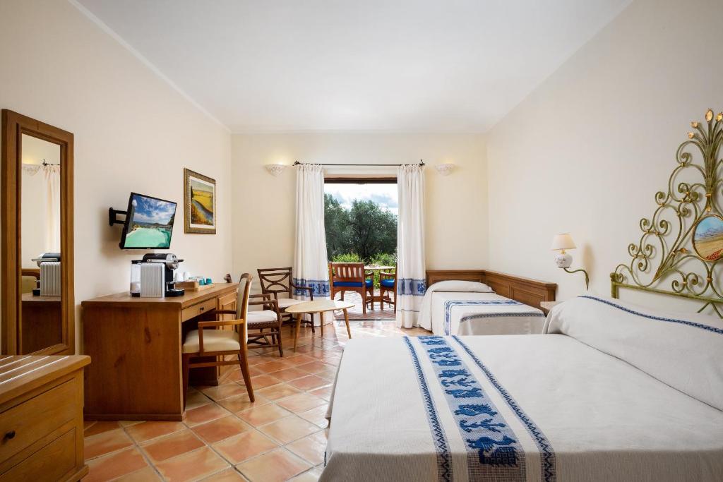 Postel nebo postele na pokoji v ubytování Felix Hotels - Country Resort Parco degli Ulivi