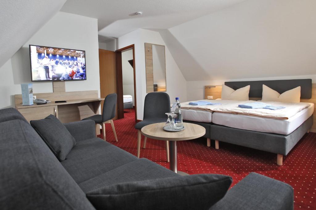 Postel nebo postele na pokoji v ubytování Hotel & Restaurant Am Wasser