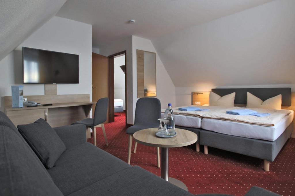 Postel nebo postele na pokoji v ubytování Hotel & Restaurant Am Wasser