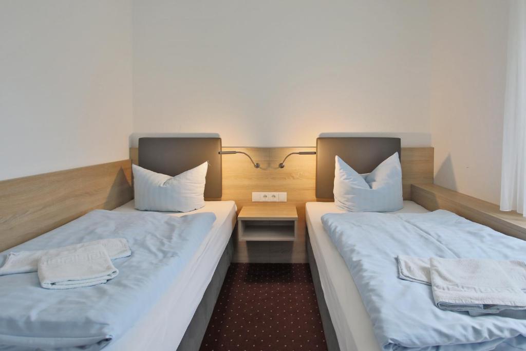 Postel nebo postele na pokoji v ubytování Hotel & Restaurant Am Wasser