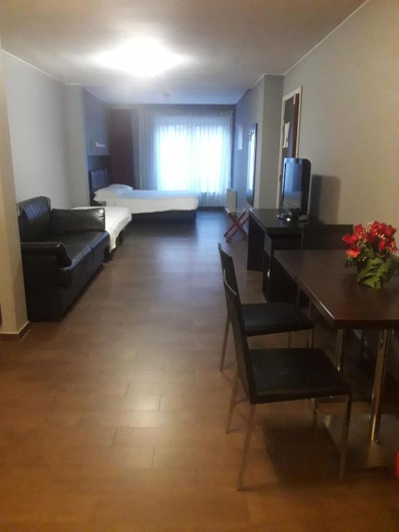 Postel nebo postele na pokoji v ubytování Hotel La Louve