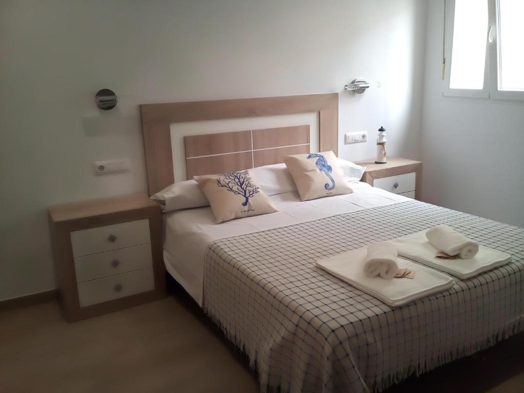 A bed or beds in a room at Casa María