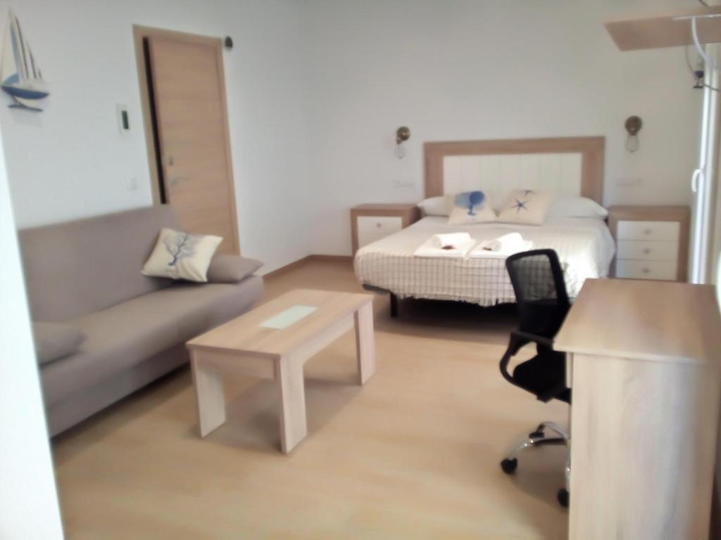 A bed or beds in a room at Casa María