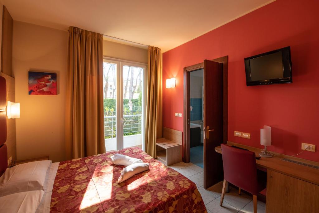 Postel nebo postele na pokoji v ubytování Hotel Mondial