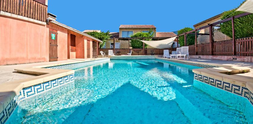 a swimming pool with blue water in a house at Verdon Vacances in Saint-André-les-Alpes