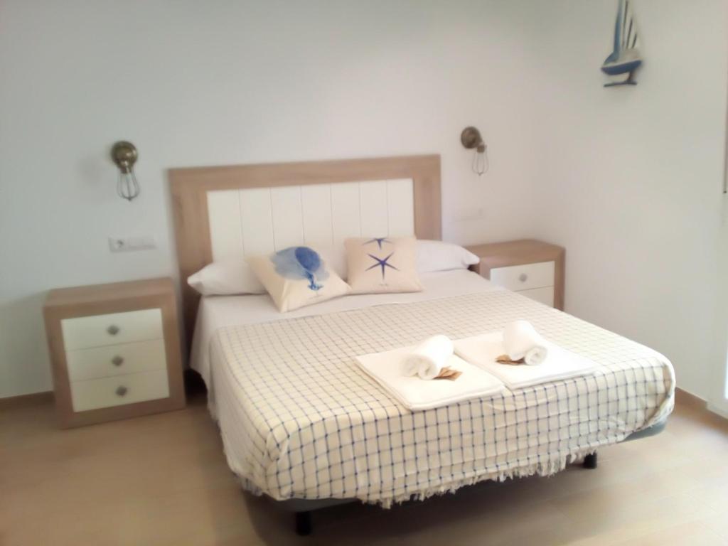 A bed or beds in a room at Casa María