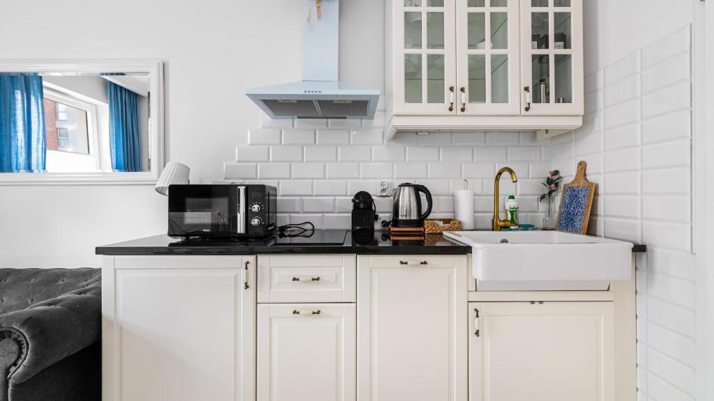 Kuchyňa alebo kuchynka v ubytovaní Comfy Apartments - Stare Miasto z Ogrodem