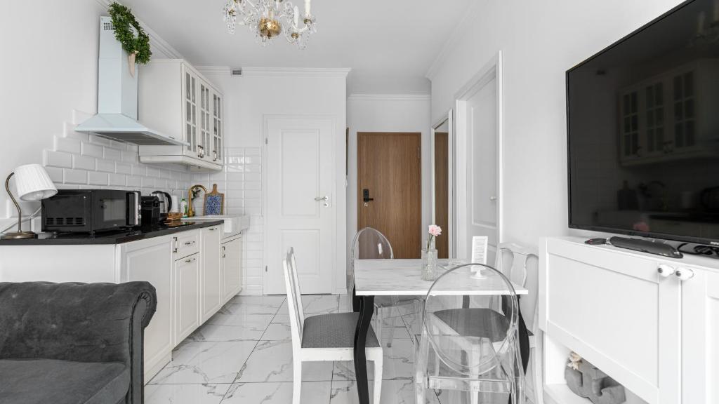 Kuchyňa alebo kuchynka v ubytovaní Comfy Apartments - Stare Miasto z Ogrodem