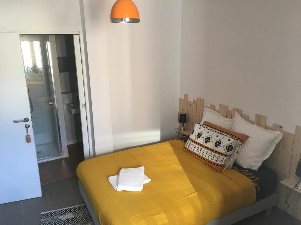 Postel nebo postele na pokoji v ubytování Les Trois Temps