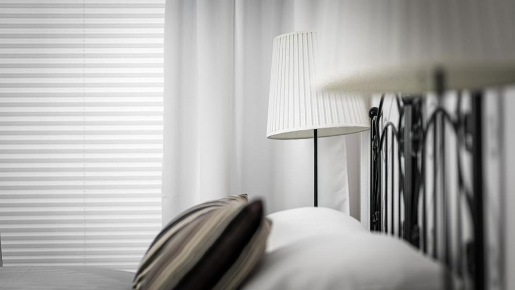 Posteľ alebo postele v izbe v ubytovaní Comfy Apartments - Stare Miasto z Ogrodem