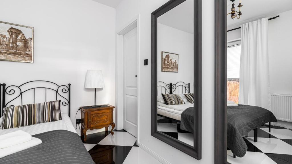 Posteľ alebo postele v izbe v ubytovaní Comfy Apartments - Stare Miasto z Ogrodem