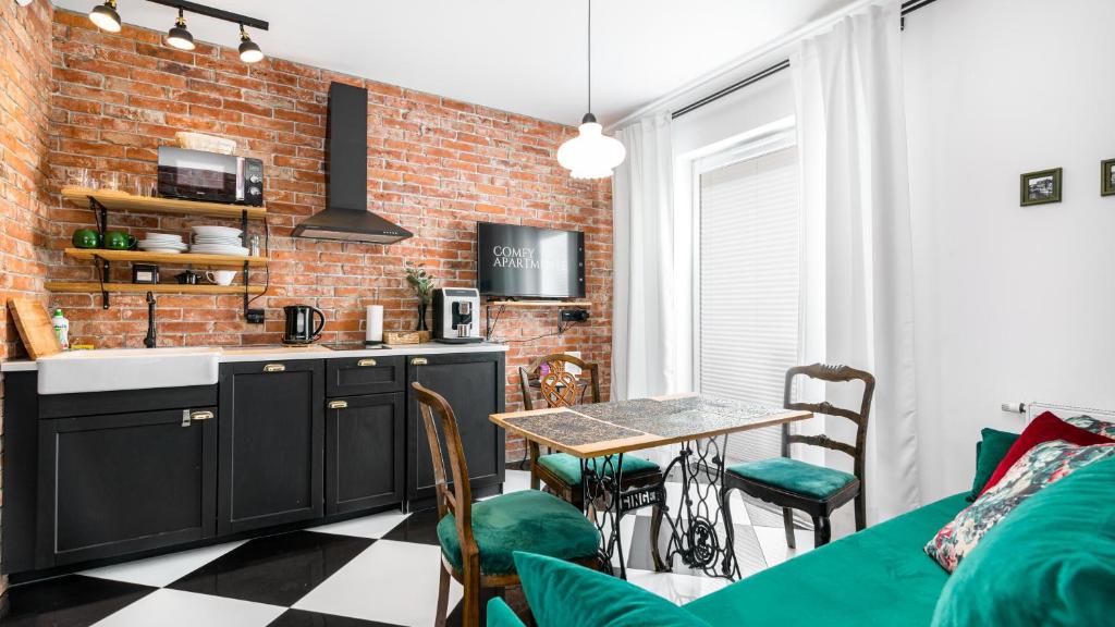 Kuchyňa alebo kuchynka v ubytovaní Comfy Apartments - Stare Miasto z Ogrodem
