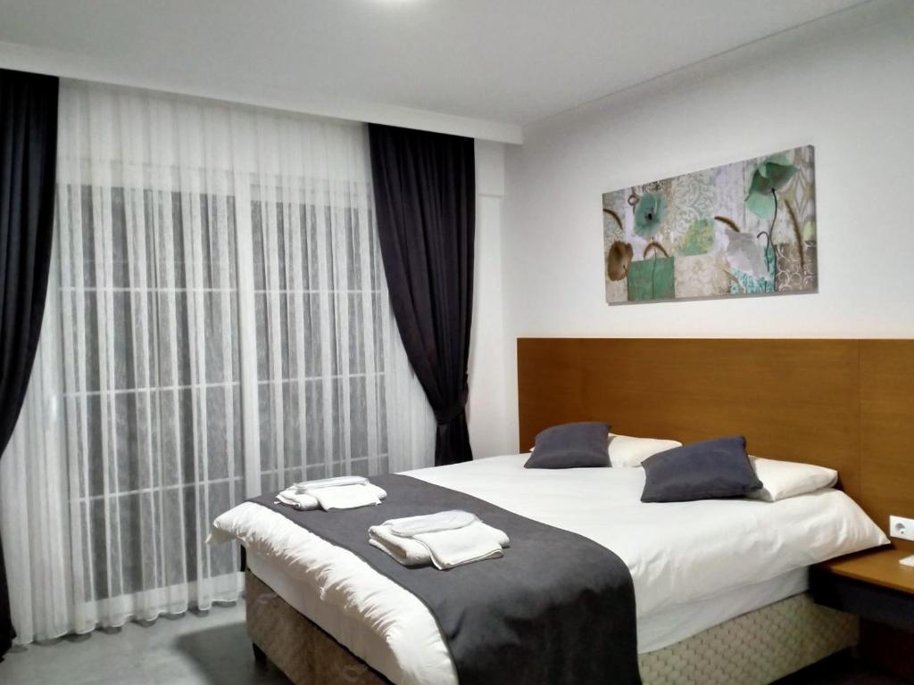 Postel nebo postele na pokoji v ubytování AdaHan Family Rooms Gocek