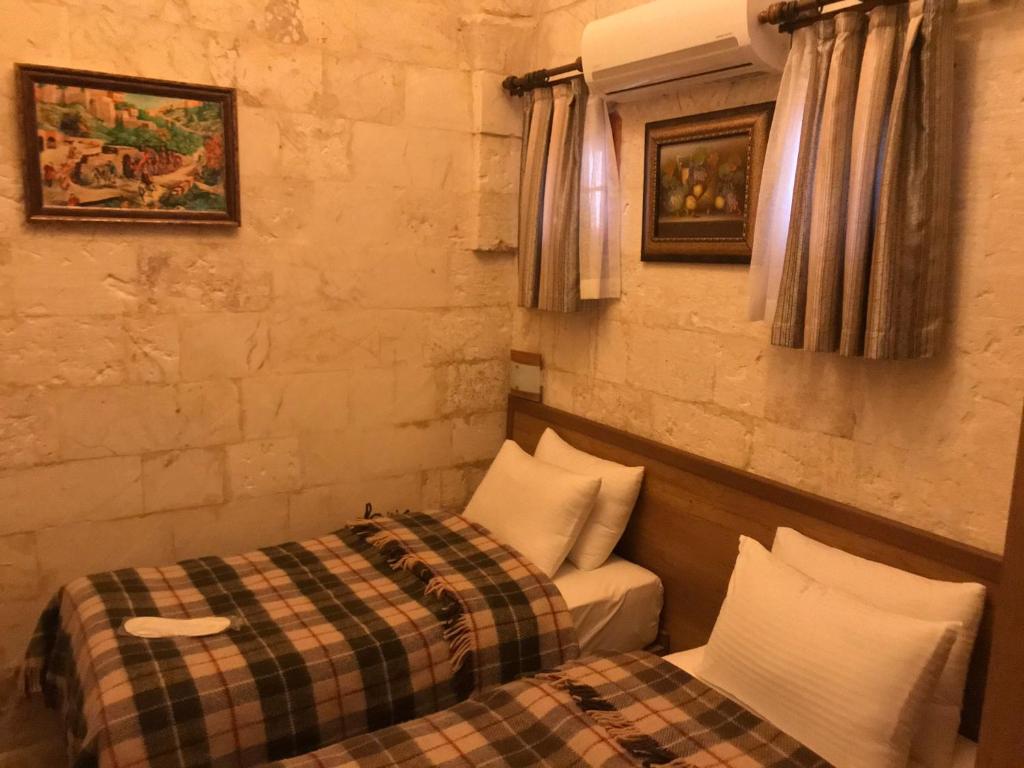 Postel nebo postele na pokoji v ubytování Gazel Butik Otel