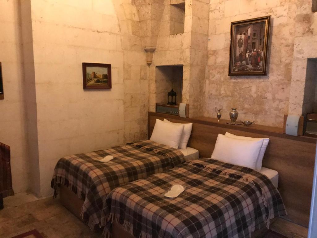 Postel nebo postele na pokoji v ubytování Gazel Butik Otel