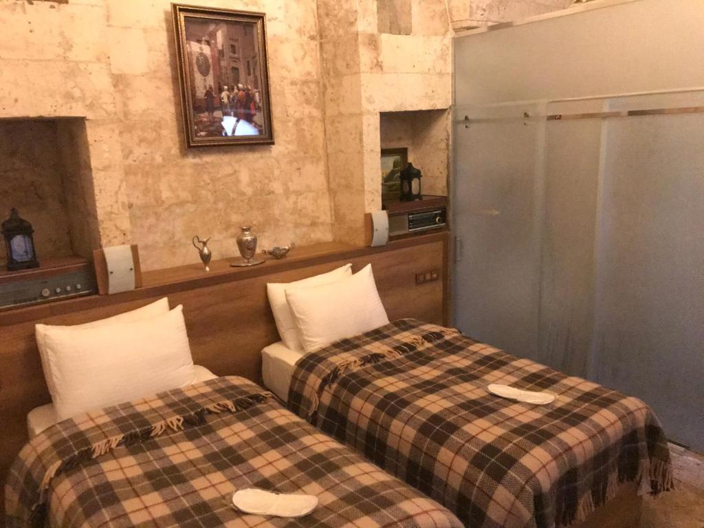 Postel nebo postele na pokoji v ubytování Gazel Butik Otel
