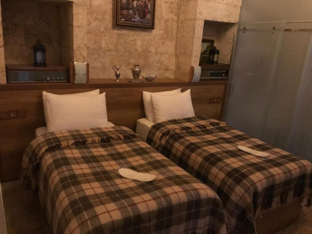 Postel nebo postele na pokoji v ubytování Gazel Butik Otel