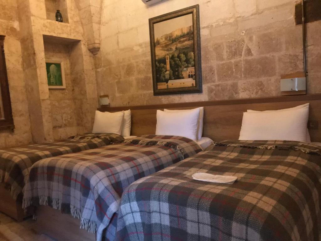 Postel nebo postele na pokoji v ubytování Gazel Butik Otel