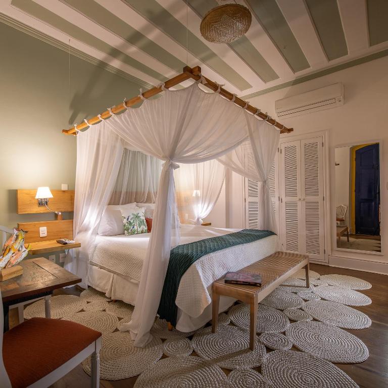 Postel nebo postele na pokoji v ubytování Sandi Hotel