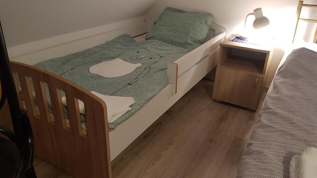 Posteľ alebo postele v izbe v ubytovaní Pokoje Gościnne Art- Dworek
