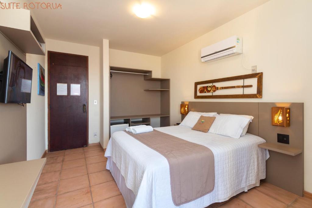 Cama ou camas em um quarto em Pousada Kia Ora Bombinhas