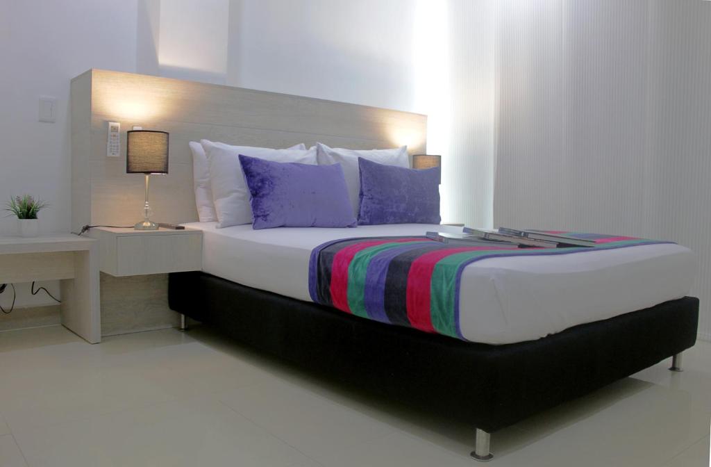 Postel nebo postele na pokoji v ubytování Hotel Suite Comfort