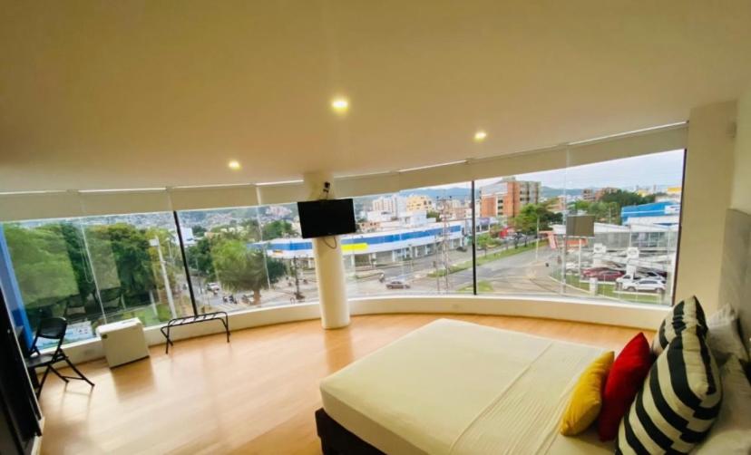 Voodi või voodid majutusasutuse Hotel Metropolis Plaza Cali toas