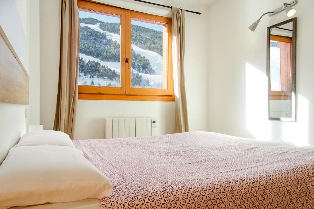 Ένα ή περισσότερα κρεβάτια σε δωμάτιο στο Apartamento Tarter Parc 1 habitación